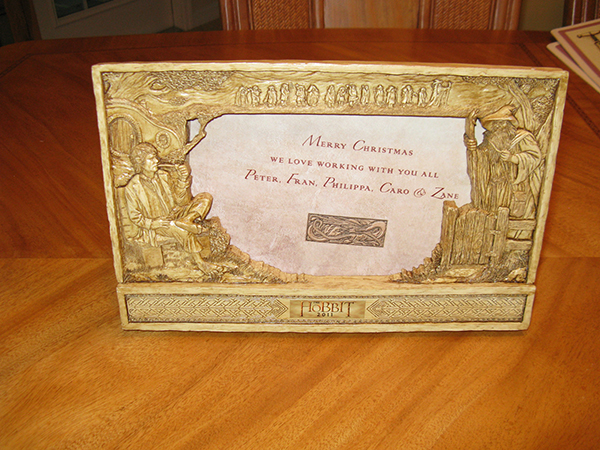 <br />

Hobbit picture frame which was presented by Peter Jackson and other production personnel as a Christmas gift to some of the staff and crew members who worked on The Hobbit movie due for release in December 2012. The frame is constructed of hardened resin material and provides a detailed relief of the figures of Bilbo and Gandalf.