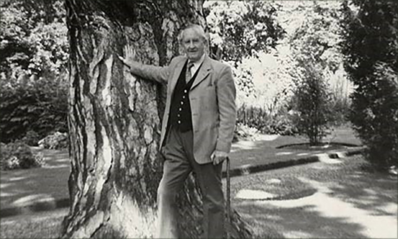 JRR Tolkien with the black pine in Oxford Botanic Garden.

<br/><br/>

Tolkien often sat and wrote beneath its branches. It is said, that its whirl-patterned bark inspired his creation of the Ents.

<br/><br/>

It is reported that the last photo of Tolkien before he died was of him standing with his hand on the trunk of this tree.<span class="ngViews">2 views</span>